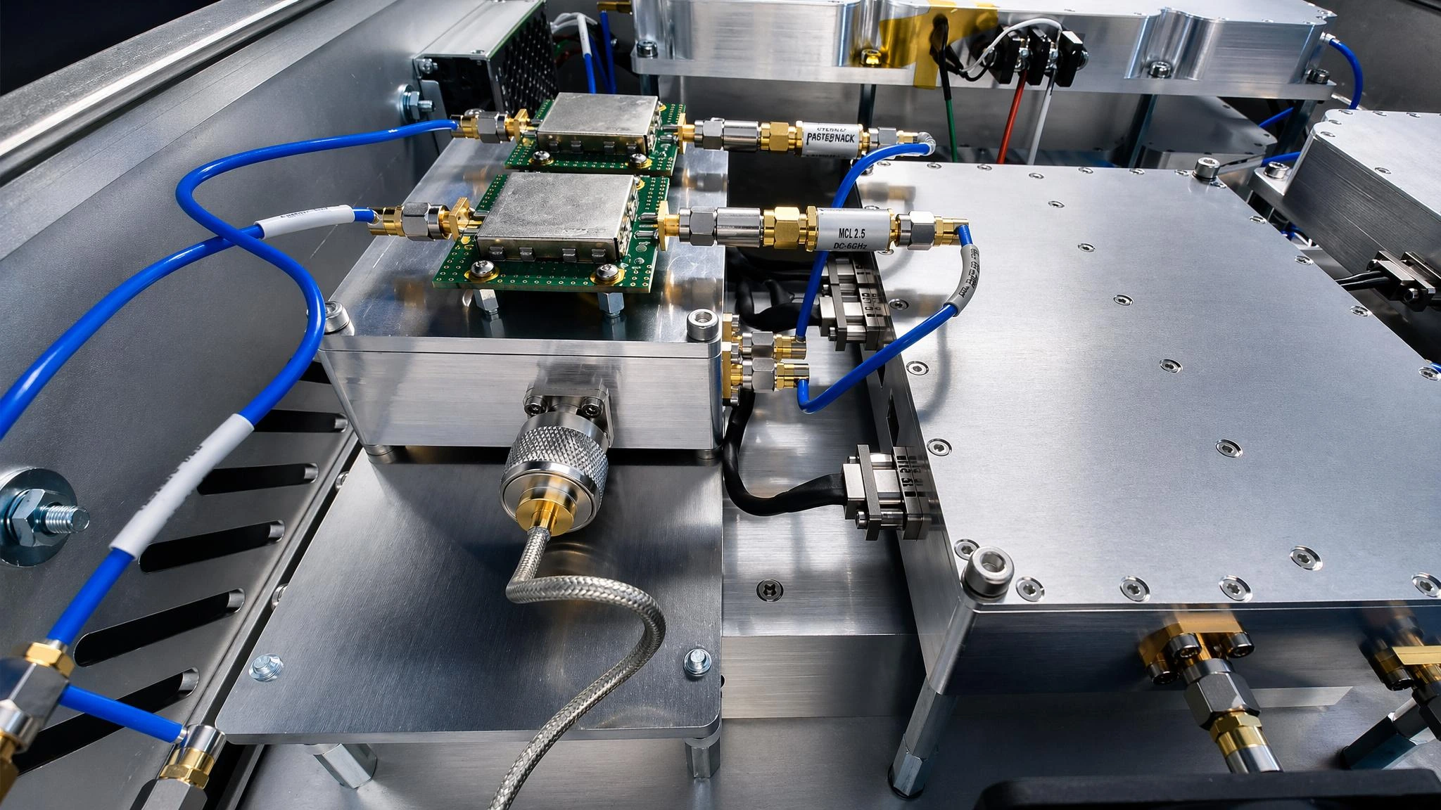 Interior of an E-REON RF system showing shielded RF modules, coaxial interconnections and machined aluminium assemblies