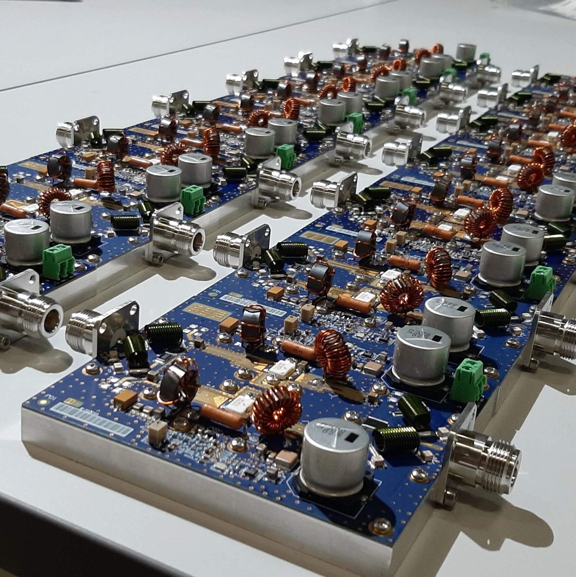 Multiple populated RF amplifier boards arranged for equipment assembly